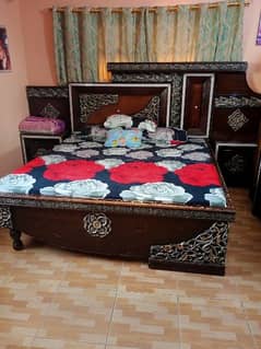 a bed with metrice dressing nd wordrobe in used condition