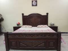 brown color wooden bed without mattress