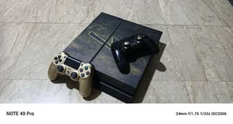 ps4 with two controllers with 7 discs
