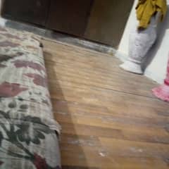 wooden flooring almost one room ki hai