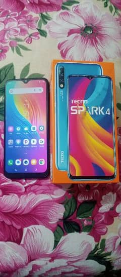 Tecno Spark 4 with box and charger