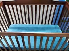 baby cot and cupboard