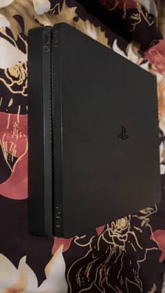 ps4 slim with 2 controllers and 4 games