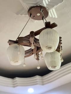 two wooden chandeliers/fanuus/light