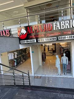 Al majid fabrics Brand sale in new city phase 2 near tandoori