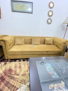 seven seater sofa with coffee table and three curtains