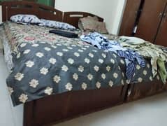 2 single wooden bed