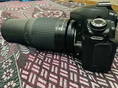 Nikon D90 with lens 70-300mm