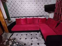 Red coloured beautiful sofa.