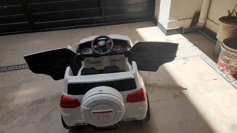 charging car for kids with remote all condition is good color is white 6