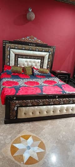 Stylish kings size bed, dressing table with two side tables.