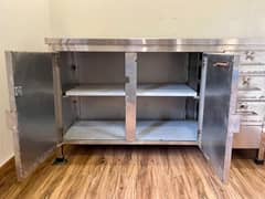 stainless steel table with cupboards
