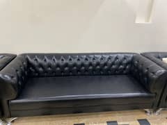 Black leather sofa .