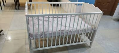 baby cot and diaper changing racks