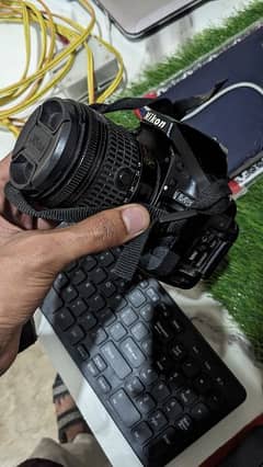 Nikon D5200 with kit lens & 2 batteries