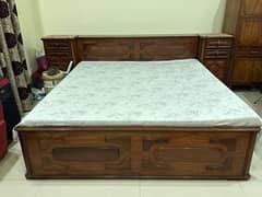 wooden bed with 2 side tables