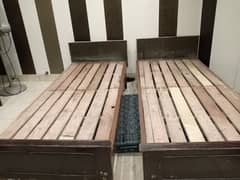 Two  wooden single Beds