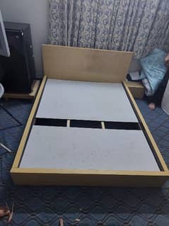 Queen size bed with two side tables