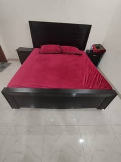 Bed with side tables and dressing table