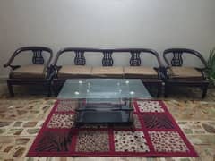wooden sofa and center table