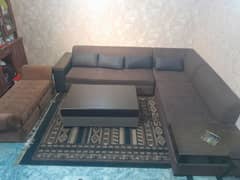 L shape sofa with table and setty