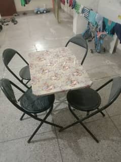 set of 4 chairs along with centre table