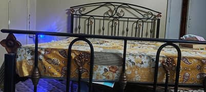 rod iron king bed