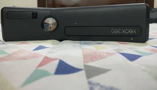 XBox 360slim version with controller & adopter,79 games installed.