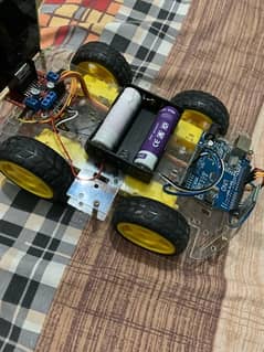 Hand made robotic car with bluetooth control