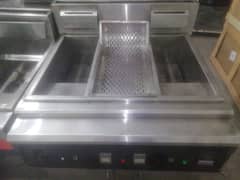 deep Fryer double tank with center sizzling automatic used but new