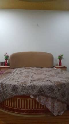 round bed with meatress and side table dressing tabel