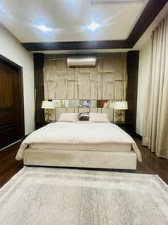 1 Kanal fully furnished 6 luxurious bedrooms 3 kitchens, 10 inverter A. C, with basement mini cinema, at very prime location of Tulip Block, Bahria Town Lahore