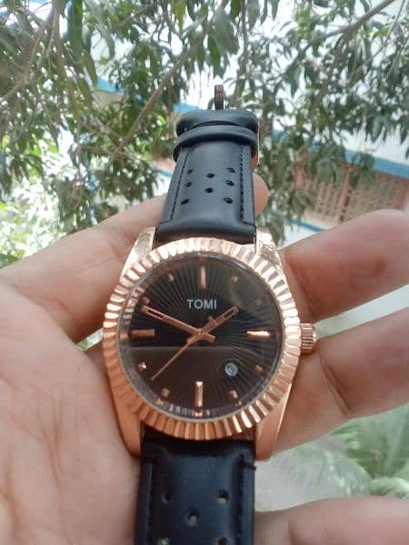 original Tomi watch black and rose gold combination. 0