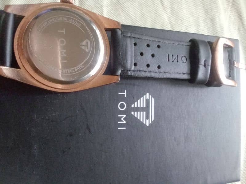 original Tomi watch black and rose gold combination. 4