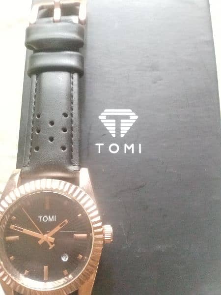 original Tomi watch black and rose gold combination. 5