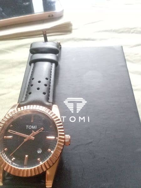 original Tomi watch black and rose gold combination. 6