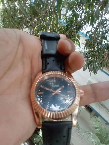 original Tomi watch black and rose gold combination. 7