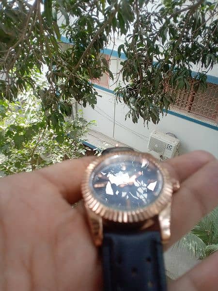 original Tomi watch black and rose gold combination. 8