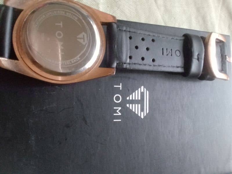 original Tomi watch black and rose gold combination. 9