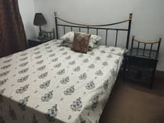 wrought iron bed with side table and Mattress