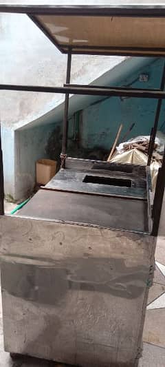 fast food counter with fryer.