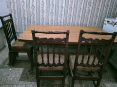 6 wooden chairs with dining table