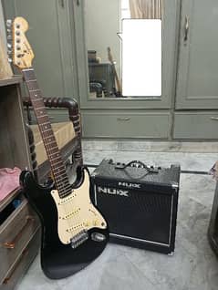 Vintage Squier Affinity Series Stratocaster with Nux Mighty 15SE Amp.