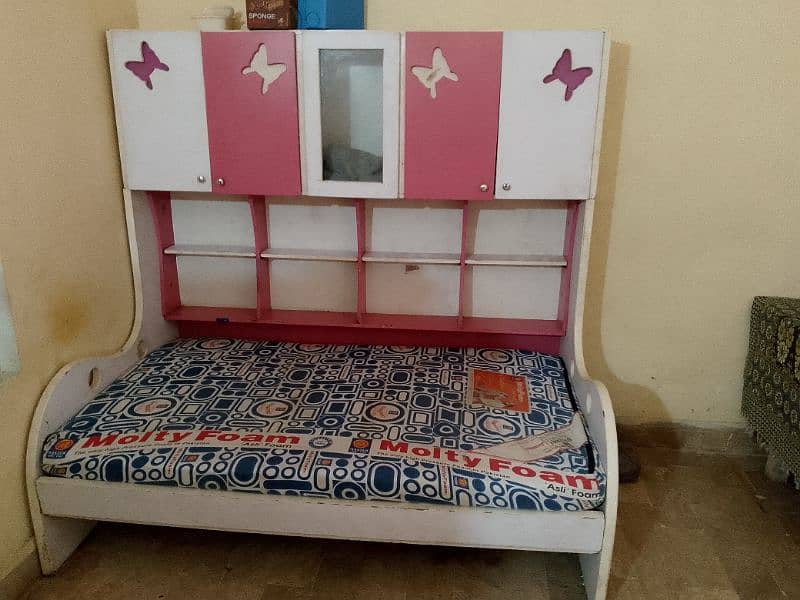 single bed with books and toy racks with molty foam mattress 0