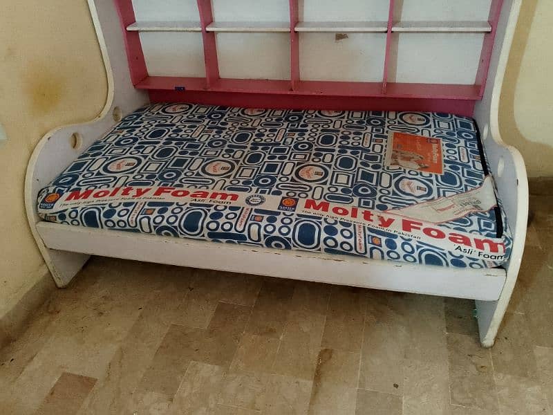 single bed with books and toy racks with molty foam mattress 10