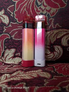 two vapes 1 strawberry 2 peach