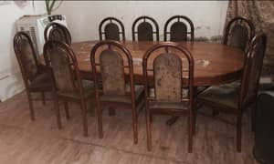 Dining table with 10 sheesham wood chairs.