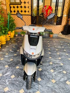 Metro T9 scooty in grey colour