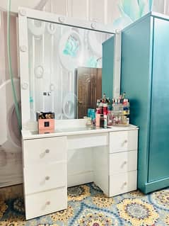 white colour vanity/showcase with lights and rotating organizer
