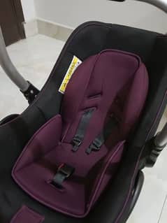 Carry cot in black and maroon